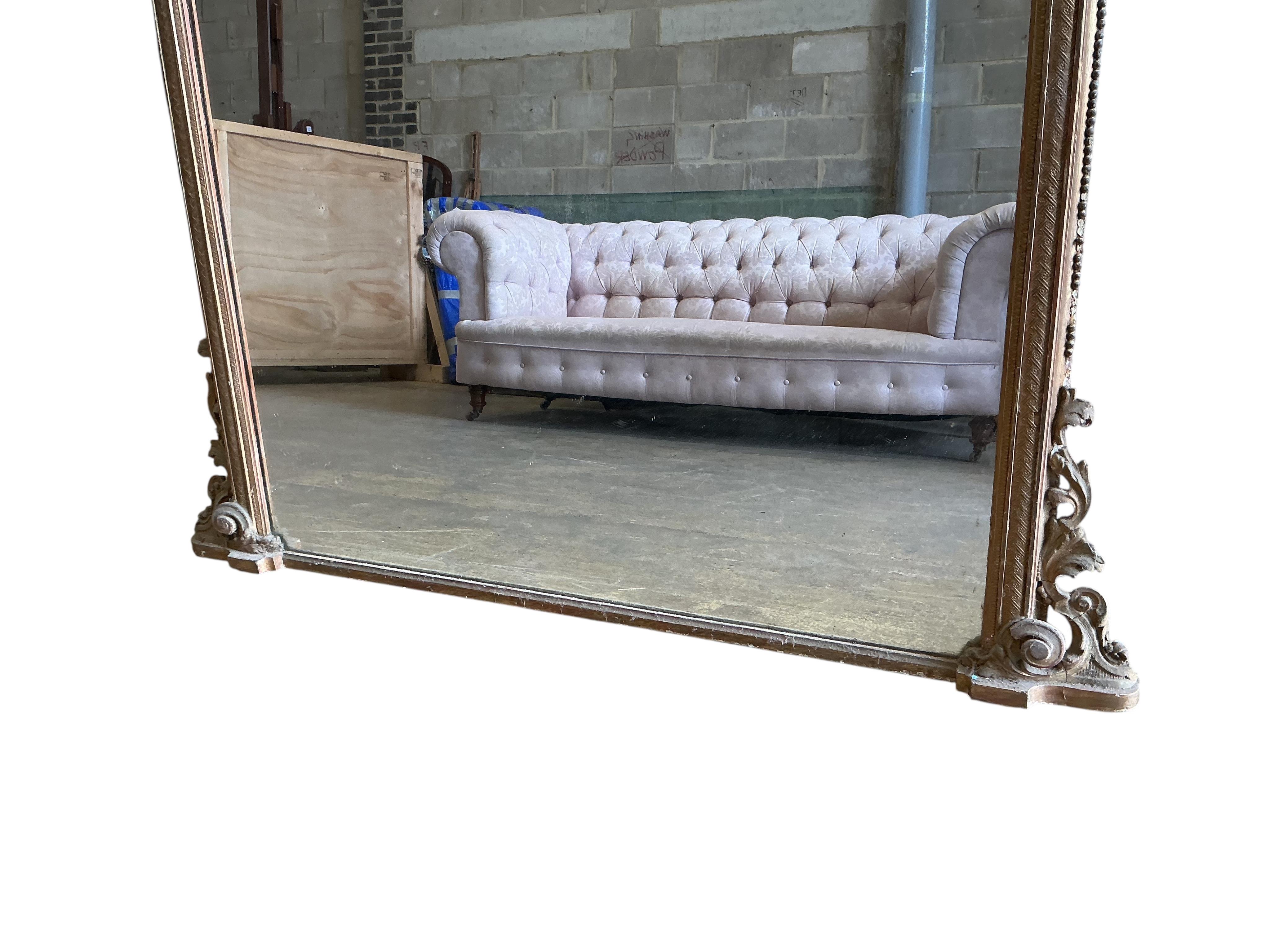 A large Victorian giltwood and composition overmantel mirror, width 160cm, height 184cm